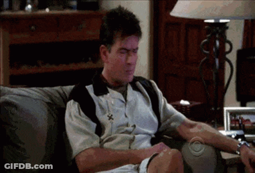 Man Sitting On Couch With CBS Logo GIF