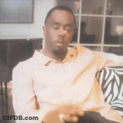Man Sitting On Couch With Eyes Closed GIF