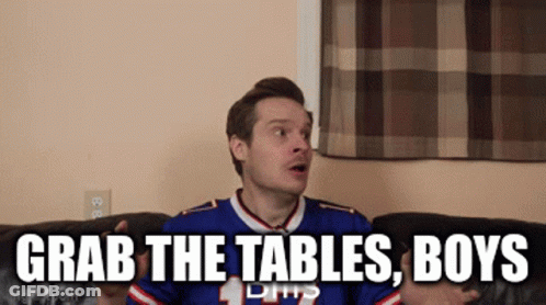 Man Sitting On Couch With Grab The Tables Boys GIF