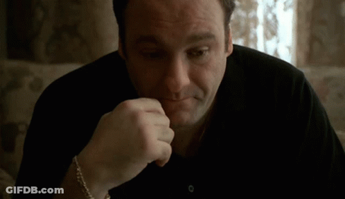 Man Sitting On Couch With Hand On Chin GIF