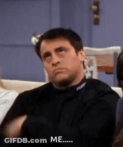 Man Sitting On Couch With Hands In Pockets Says Me GIF