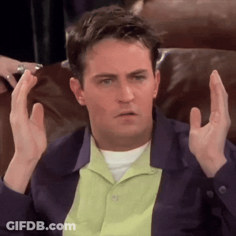 Man Sitting On Couch With Hands Up GIF