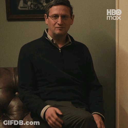 Man Sitting On Couch With HBO Max Logo GIF
