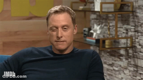 Man Sitting On Couch With IMDb Shirt GIF