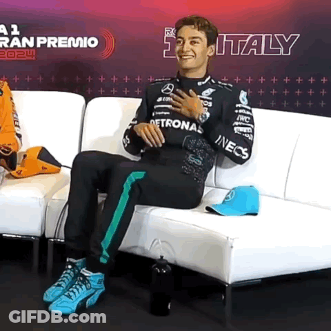Man Sitting On Couch With Italy Sign GIF