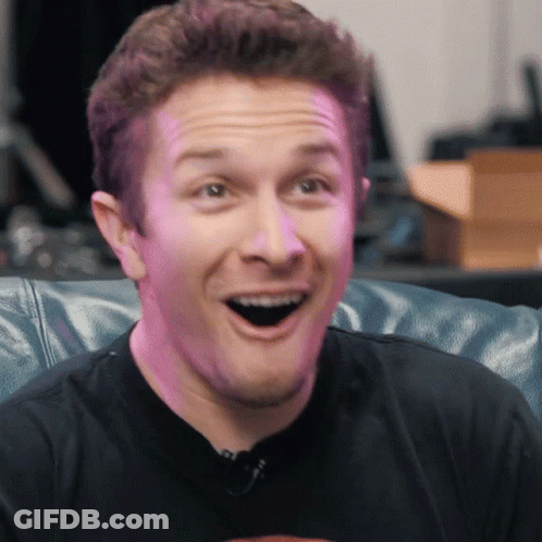 Man Sitting On Couch With Mouth Open GIF