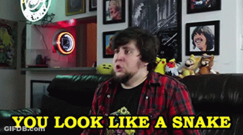 Man Sitting On Couch You Look Like A Snake GIF