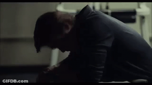 Man Sitting On Floor In Dark Room GIF