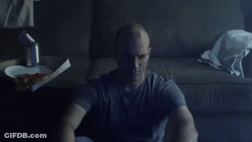 Man Sitting On Floor With Box Of Pizza GIF
