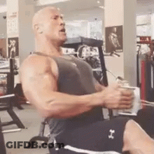 Man Sitting On Gym Bench Doing Machine Exercises GIF