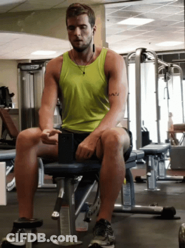 Man Sitting On Gym Bench With Faith Tattoo GIF