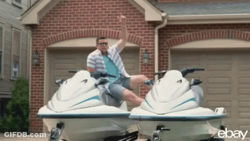 Man Sitting On Jet Ski In Front Of Garage GIF