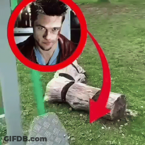 Man Sitting On Log With Red Arrow GIF