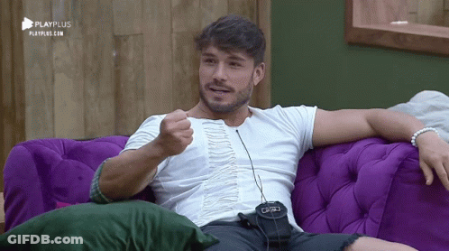 Man Sitting On Purple Couch With Playplus GIF