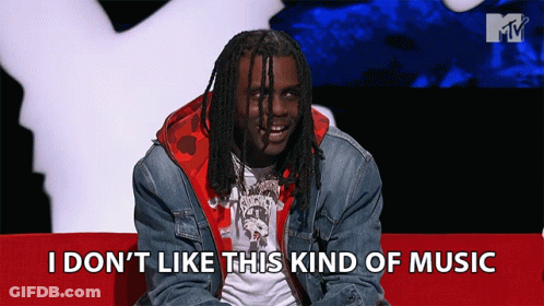 Man Sitting On Red Couch Saying I Don T Like This Music GIF