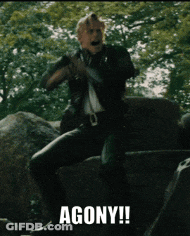 Man Sitting On Rock In Agony GIF
