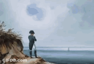 Man Sitting On Rock Near Water GIF
