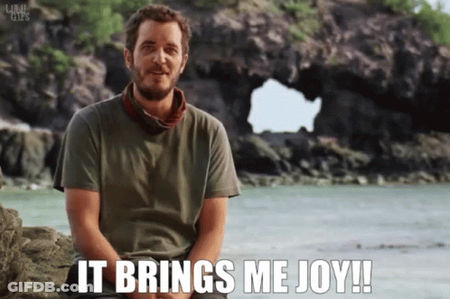 Man Sitting On Rock Saying It Brings Me Joy GIF