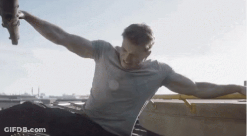 Man Sitting On Roof With Arms Outstretched GIF