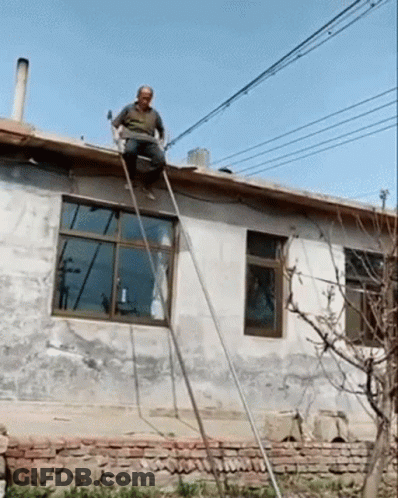Man Sitting On Roof With Ladder GIF