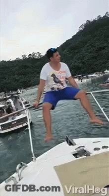 Man Sitting On Side Of Boat In Water GIF