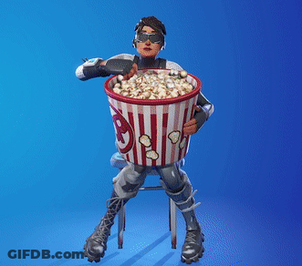 Man Sitting On Stool Holding Popcorn Bucket GIF