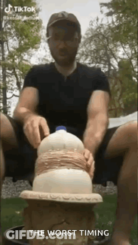 Man Sitting On Stool With Bottle Of Milk GIF