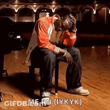 Man Sitting On Stool With Head In Hands GIF