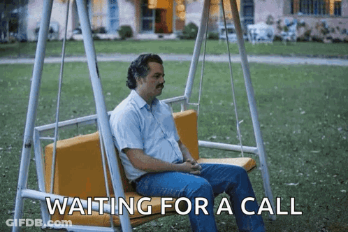 Man Sitting On Swing Waiting For A Call GIF