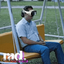 Man Sitting On Swing Wearing VR Headset GIF