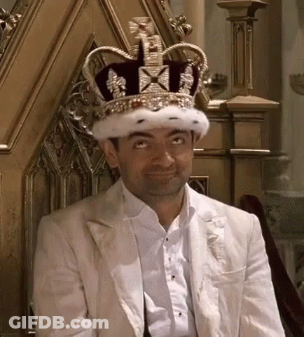 Man Sitting On Throne In Crown And White Jacket GIF