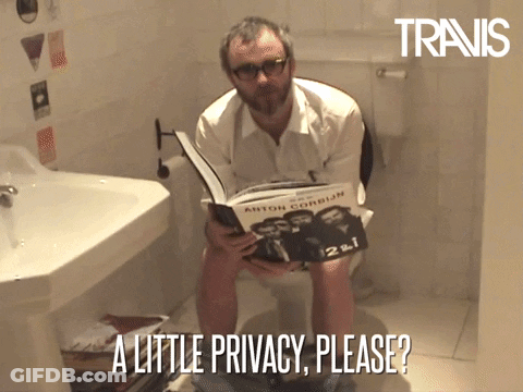 Man Sitting On Toilet Holding Book GIF