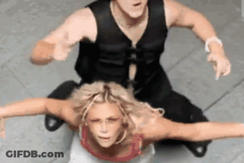Man Sitting On Top Of Woman Pointing GIF