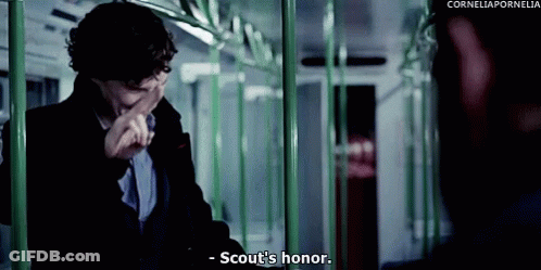 Man Sitting On Train Covering Mouth Saying Scout's Honor GIF