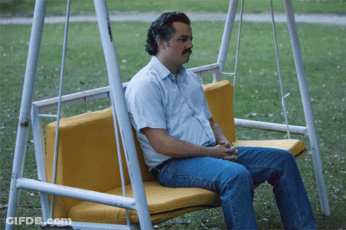 Man Sitting On Yellow Swing GIF