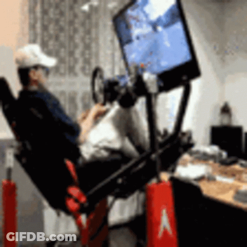 Man Sitting Playing Video Game Simulator GIF