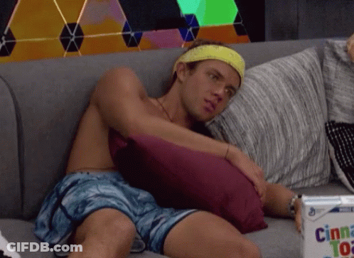 Man Sitting Shirtless With Cinnamon Pastries GIF