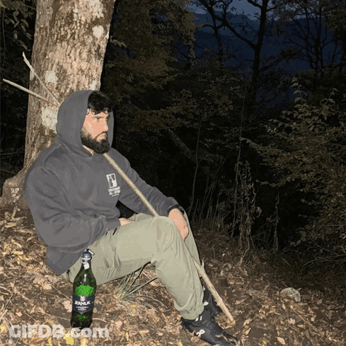Man Sitting Under Tree With Aquafina Bottle GIF