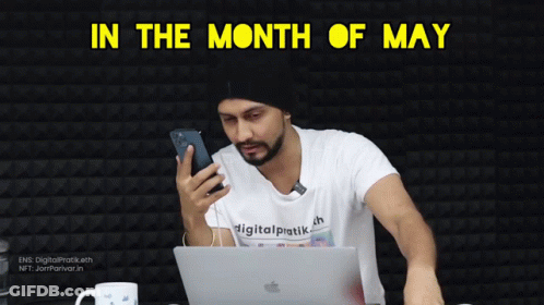 Man Sitting With Apple Laptop And Phone GIF