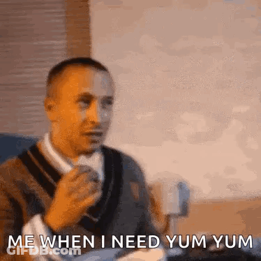Man Sitting With Coffee Saying Yum Yum GIF
