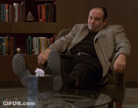 Man Sitting With Feet Up Next To Tissue Box GIF