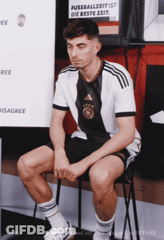 Man Sitting With Fussballzeit Ist Die Beste Zeit Sign GIF