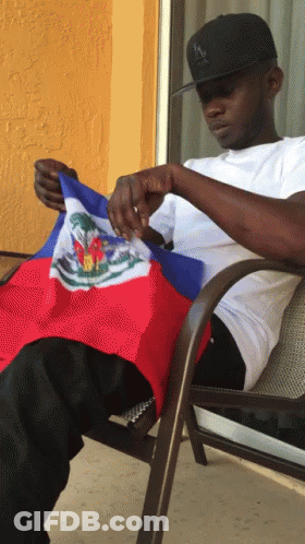 Man Sitting With Haitian Flag GIF