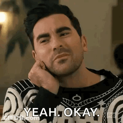 Man Sitting With Hand On Chin Saying Yeah Okay GIF