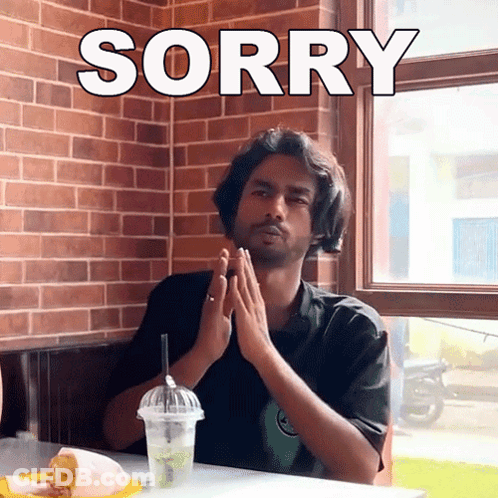 Man Sitting With Hands Folded Saying Sorry GIF