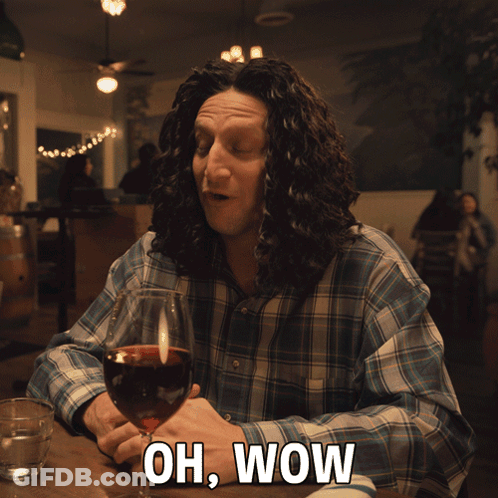 Man Sitting With Wine Saying Oh Wow GIF