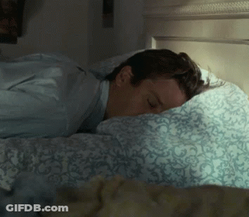 Man Sleeping On Bed With Blue Comforter GIF