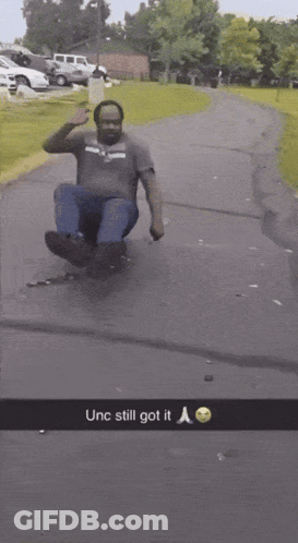 Man Sliding Down Road Saying Unc Still Got It GIF
