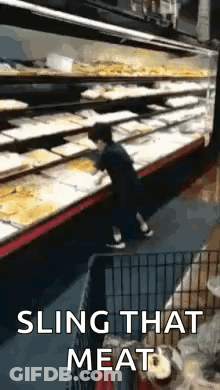 Man Slinging Meat Dog Watches In Grocery Store GIF