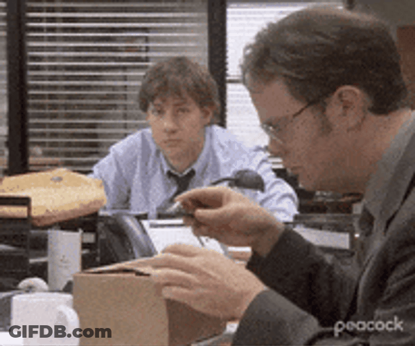 Man Slowly Cutting Box From Box GIF
